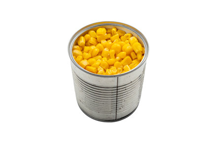 Open Tin Can with Corn. An open tin can filled with sweet corn kernels, isolated on a white background. Bright yellow corn fills the container to the brim.の写真素材