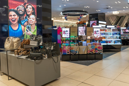 Germany Berlin December 3, 2025. Department store cosmetics and accessories area with handbag...