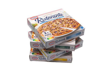 Germany Berlin January 30, 2026. Angled stack of assorted Dr. Oetker Ristorante frozen pizzas isolated on white. Dynamic composition highlighting variety and packaging design for advertising use.の写真素材