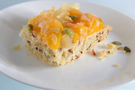 shortbread with mango, pineapple and pumpkin seedsの写真素材