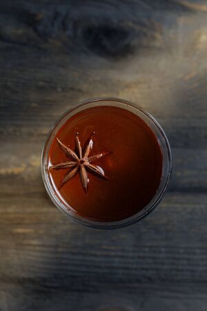 the star anise in the shot with a cocktail. top view.の写真素材