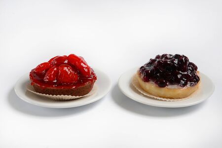 baskets of dough with berries (strawberries and currants) on a white background.の写真素材