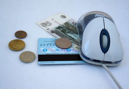 computer mouse, credit card and cash russian money on the gray-whiteの写真素材