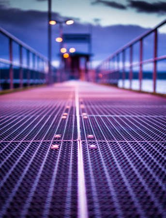 Motivational night light plank in a German harbour at the golden hour.の写真素材