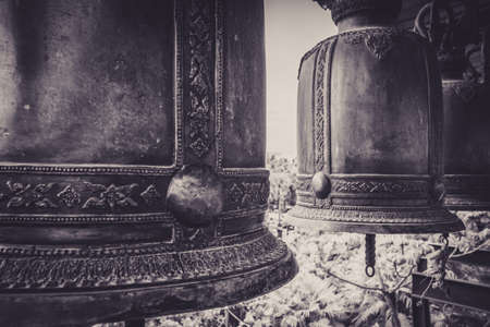 Hynotizing traditional bells in a temple in Thailand photographed in noir/ black and white.の写真素材