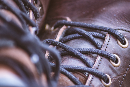 Closeup of sandy leather boots.の写真素材