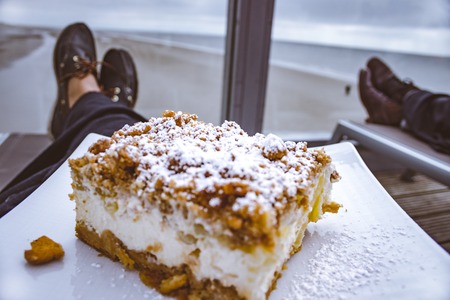 Eating apple crumble pie while relaxing on the beach in Germany.の写真素材