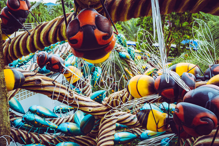 Macro artworks of insects in a playground of a flower park in Thailand.