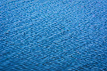 Blue tones water waves surface as background