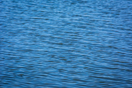 Blue tones water waves surface as background
