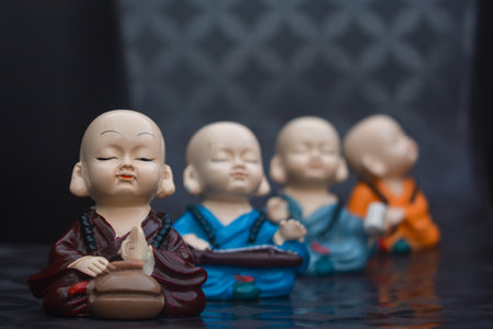 Four cute little buddhist monksの写真素材