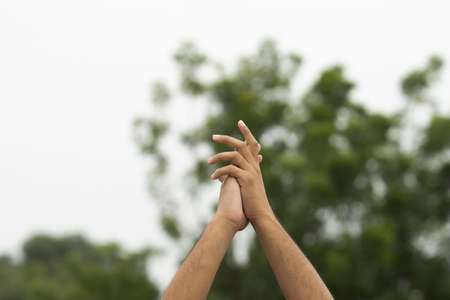 male hand gesture and signs on outdoor backgroundの写真素材