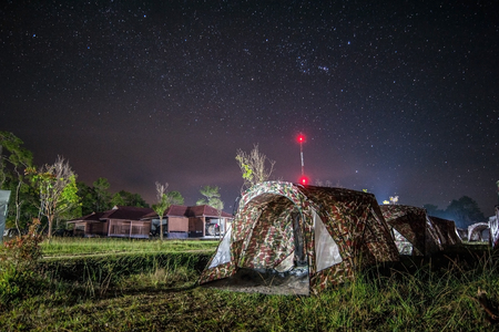 the milky way in front of a tentのeditorial素材