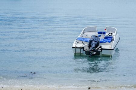 Speed boat in open blue seaの写真素材