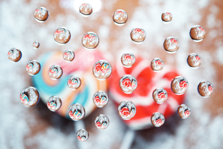 Candy heart shaped picture in water dropsの写真素材
