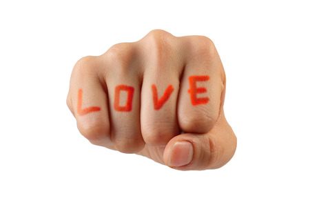 Love word in Woman hand isolated on white background with clipping pathの写真素材