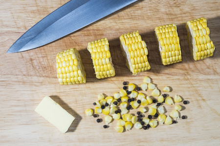 Fresh sweet corn on wooden backgroundの写真素材