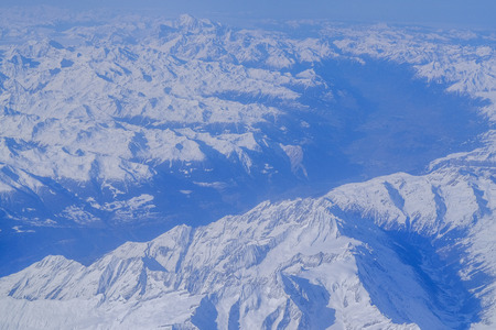 High mountains covered with snowの写真素材