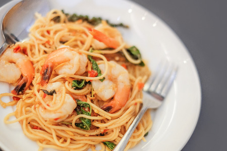Spaghetti with seafood on gray backgroundの写真素材