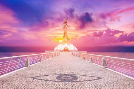 Statue of kun iam macau in sunset backgroundの写真素材