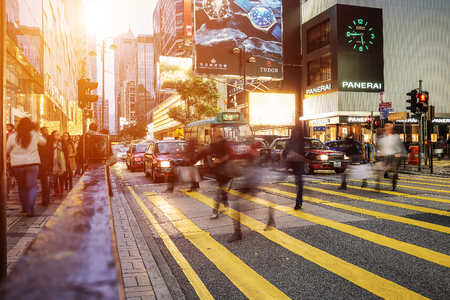 HONG KONG - JANUARY 14: People walking across Road, Causeway Bay in front of a big department store at Daylight. Hong Kong January 14, 2016のeditorial素材