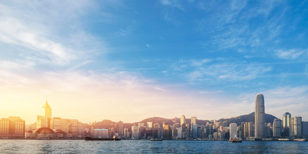 Hong Kong's Victoria Harbour in sunrise with text welcome to Hong Kong Cityの写真素材
