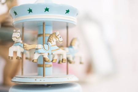 Old vintage white carousel horsesの写真素材