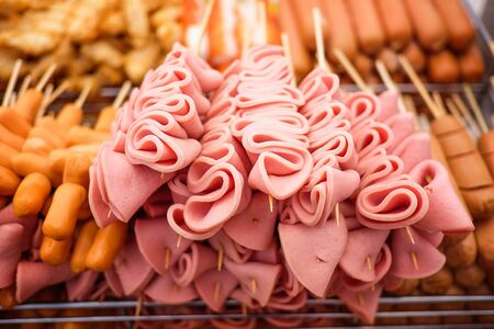 Meat ball, Sausage and ham on a stickの写真素材