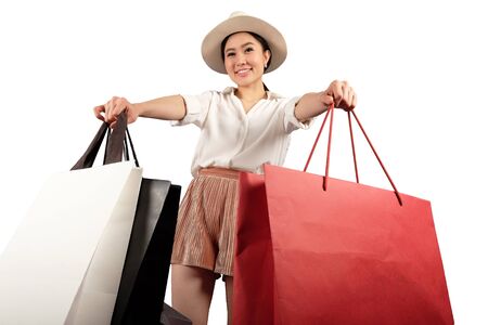 a happy women with shopping bag on white background with clipping pathの写真素材