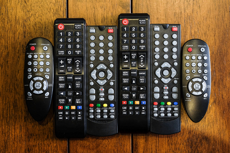 Remote control on wood the tableの写真素材