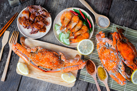 Sqide,jumbo crab and shrimp on dark backgroundの写真素材