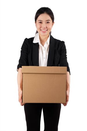 A young woman carrying a boxの写真素材