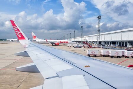 BANGKOK - September 7: In daylight Commercial aircraft wait for taking off at Don Muang international airport on September 7, 2016 in Bangkok, Thailand.のeditorial素材