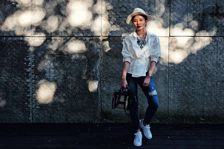 Fashion Portrait of a beautiful young woman model in white shirtの写真素材