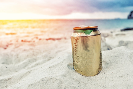 Beer can on the beachの写真素材