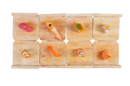 Japanese Cuisine - Sushi Roll on wood plate in white backgroundの写真素材