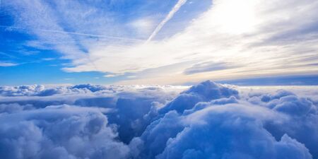 cloudy blue sky view from airplane window