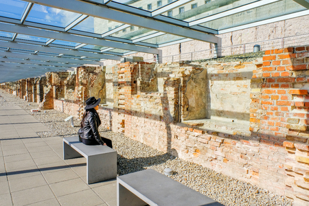 Woman looking at The wall of Topography of Terror in Berlin,Germanyの写真素材