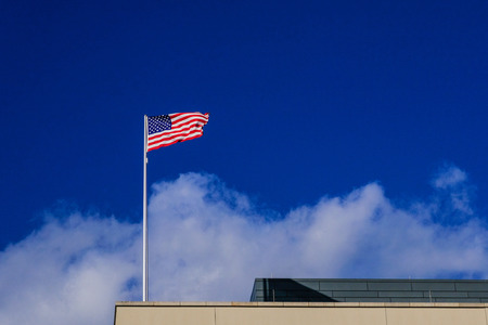 American flag on the blue skyの写真素材