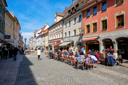 Fussen, Germany - MARCH 27, 2017: People in street at Fussen with typical bavarian architecture buildings in day light at 27 March 2017のeditorial素材