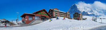 KLEINE SCHEIDEGG - 27 MARCH : Train and hotel at Kleine Scheidegg, Switzerland on March 27, 2017. Kleine Scheidegg is a famous mountain pass attracting many tourists come to playing ski each year.のeditorial素材