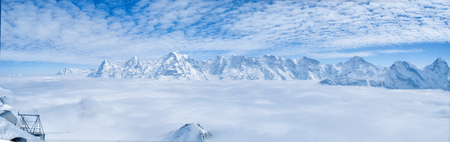 Stunning Panoramic view Snow moutain of the Swiss Skyline from Piz Gloria Schilthorn, Switzerlandの写真素材