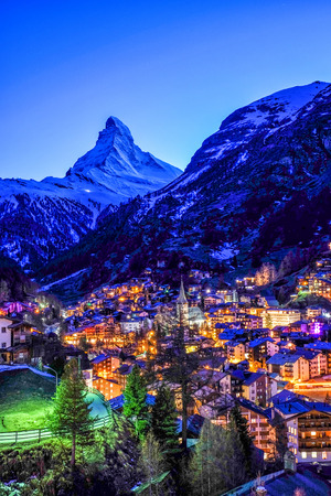 Beautiful view of old village in twilight time with Matterhorn peak background in Zermatt, Switzerland.の写真素材