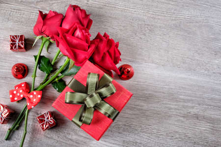 Happy Valentine's Day Concept with red roses, gift boxes and space for textの写真素材