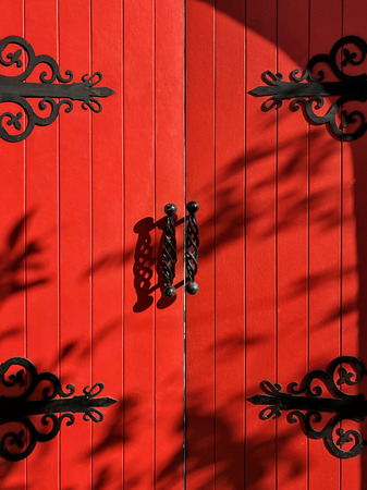 Vintage rustic exterior red door close up and detailの写真素材