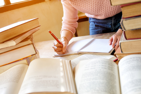 Young woman studying in libraryの写真素材