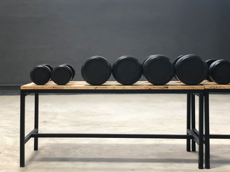 Black dumbbell set. Close up many metal dumbbells in sport fitness center の写真素材