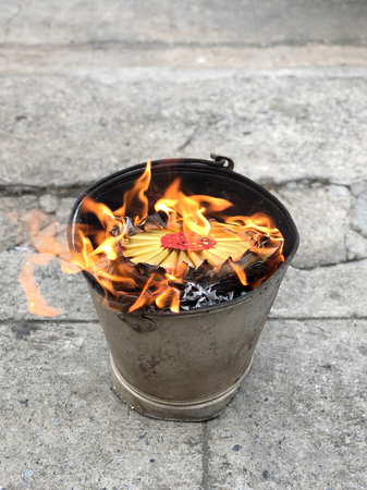 Heaven Chinese banknotes and gold paper burning in Moon Festivalの写真素材