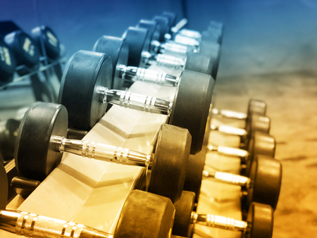 Black dumbbell set. Close up many metal dumbbells in sport fitness center の写真素材