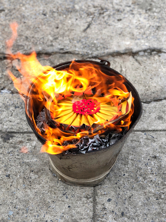 Heaven Chinese banknotes and gold paper burning in Moon Festivalの写真素材
